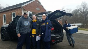 WVU Women's Basketball Players volunteering as drivers